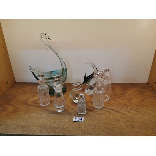 154 - Quantity of collectable glass ware inc 5x glass stoppered bottles, large swan figure, fish figure et... 