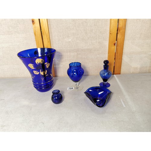 158 - Shelf full of collectable blue glass vases , blue stoppered vase, fluted bowl, etc tallest piece sta... 