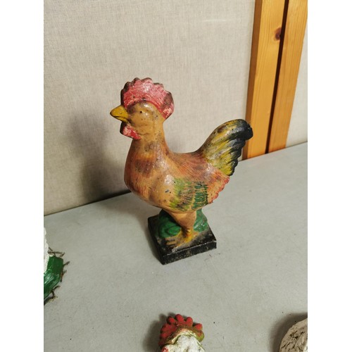 446 - 4x cast iron door stops to include 2x chicken formed door stops, Cockerell door stop and a Border Co... 