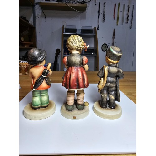 160 - 3 good vintage Goebel M.J.Hummel figures which includes a chimney sweep figure, a girl doing needlew... 