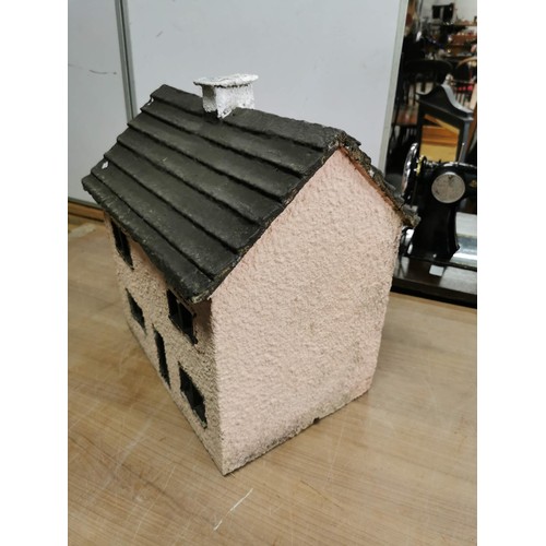 424 - Large Stoneware model house in pink with pebble dash exterior and wooden window frame and door in go... 