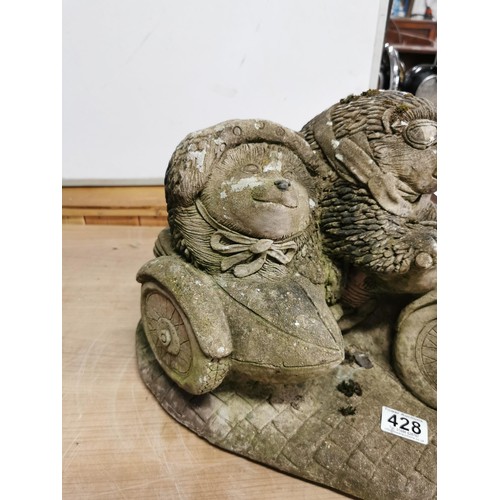 428 - Large stoneware garden ornament of two hedgehogs riding a motorcycle. In good order, stands at 28cm ... 