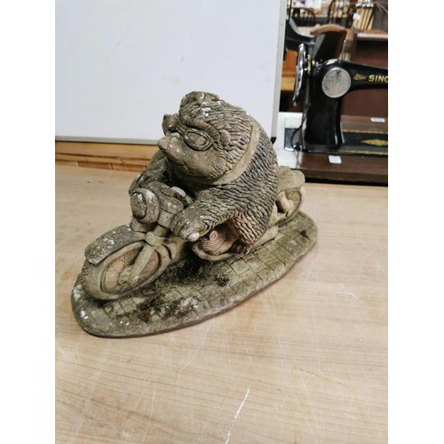 428 - Large stoneware garden ornament of two hedgehogs riding a motorcycle. In good order, stands at 28cm ... 