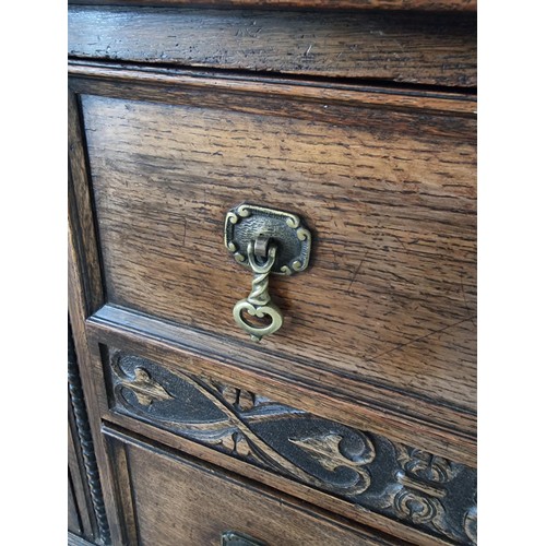 486 - A good quality solid oak antique ornate sideboard with two doors to the side and two drawers to the ... 