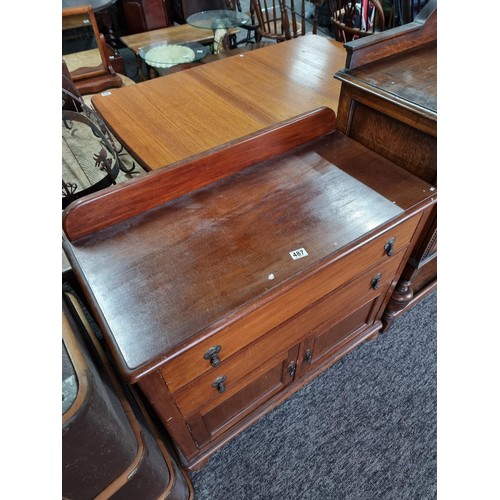 487 - Wood chest with two drawers to the top and  cupboard to the base standing on bun feet, chest measure... 