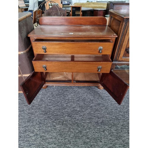 487 - Wood chest with two drawers to the top and  cupboard to the base standing on bun feet, chest measure... 