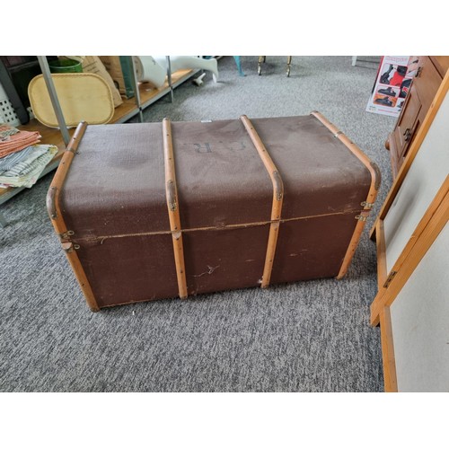 488 - Large wood bound travellers trunk in good order stamped C.R. to the top in good overall condition wi... 