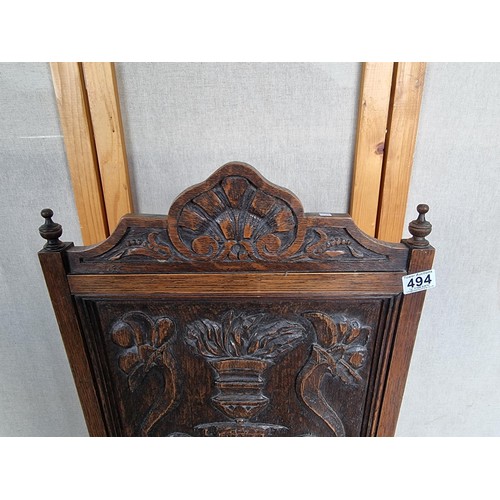 494 - Vintage highly carved wooden firescreen depicting an image of urn and floral design stands at 94cm h... 