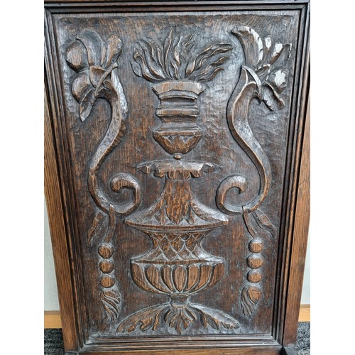 494 - Vintage highly carved wooden firescreen depicting an image of urn and floral design stands at 94cm h... 