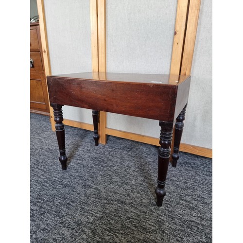 496 - A good quality Victorian mahogany occasional table with concealed bidet / babies bath inset, top lif... 