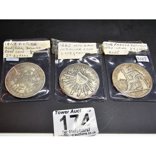 174 - A collection of 3 antique coins to include an 1882 Mexican 8 reales coin, a 1908 French Republic ind... 