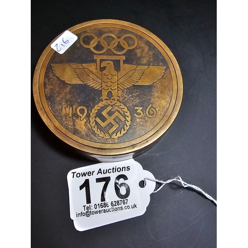 176 - A reproduction Third Reich brass compass with a screw off lid and having Third Reich graphics to the... 