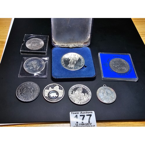 177 - A quantity of collectable coins and medals which includes a Swiss commemorative silver plated medal ... 