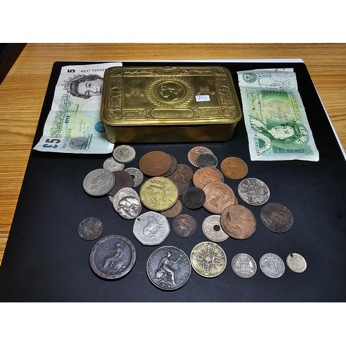 179 - An original WW1 brass Christmas tin from 1914 full of various British and world coins to include som... 