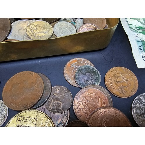 179 - An original WW1 brass Christmas tin from 1914 full of various British and world coins to include som... 