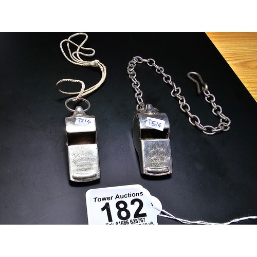 182 - 2x vintage the Acme thunderer police whistles, 1 with a metal chain the other with a rope, both in g... 