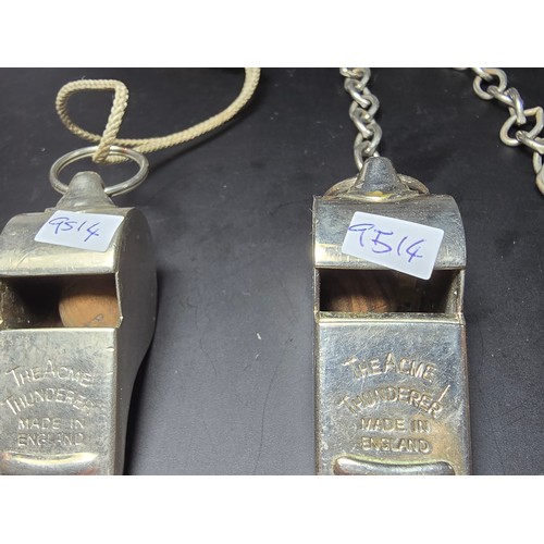 182 - 2x vintage the Acme thunderer police whistles, 1 with a metal chain the other with a rope, both in g... 