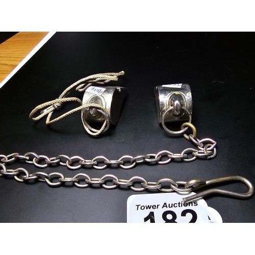 182 - 2x vintage the Acme thunderer police whistles, 1 with a metal chain the other with a rope, both in g... 