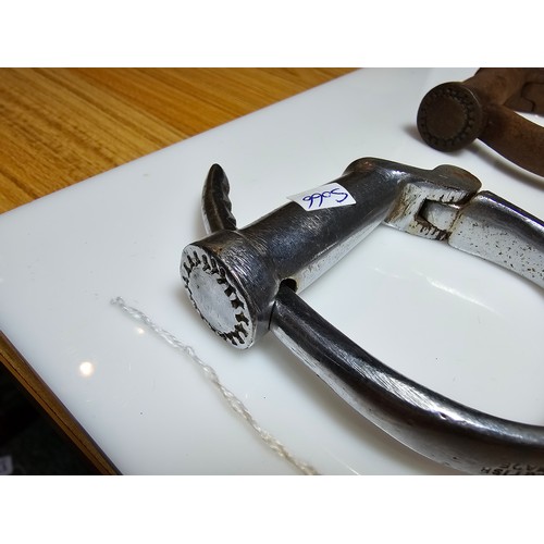 183 - A selection of police related items which includes a pair of vintage chrome handcuffs by Hiatt compl... 