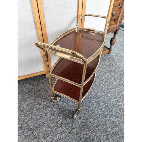 475 - Vintage brass hostess drinks / food trolley with removable top in good overall condition. Measures 7... 