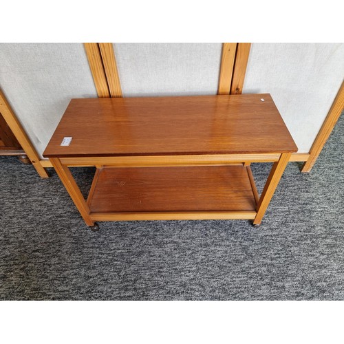 507 - Wood coffee table trolley on castors in good order measures 46cm high 74cm long and 33cm deep