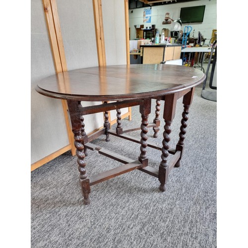 509 - Barley twist gate leg drop leaf oak dining table in good order with good colouring to the top measur... 