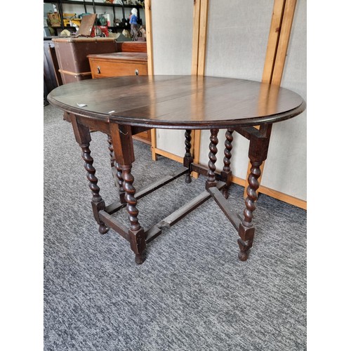 509 - Barley twist gate leg drop leaf oak dining table in good order with good colouring to the top measur... 