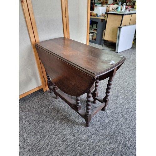 509 - Barley twist gate leg drop leaf oak dining table in good order with good colouring to the top measur... 