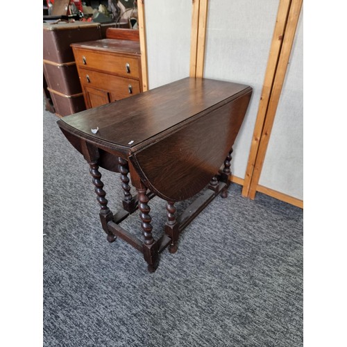 509 - Barley twist gate leg drop leaf oak dining table in good order with good colouring to the top measur... 