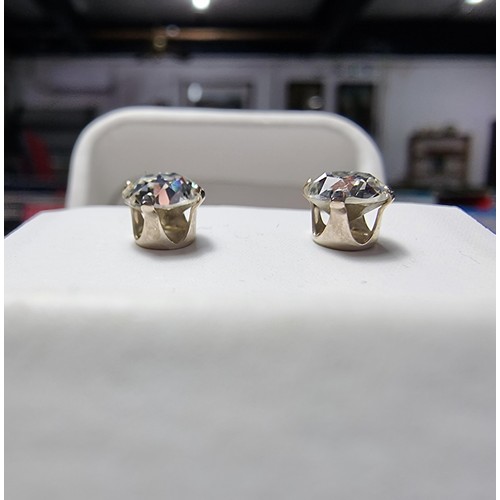 247 - A pair of 925 silver sparkly CZ stud earrings complete with butterfly backs in excellent clean condi... 