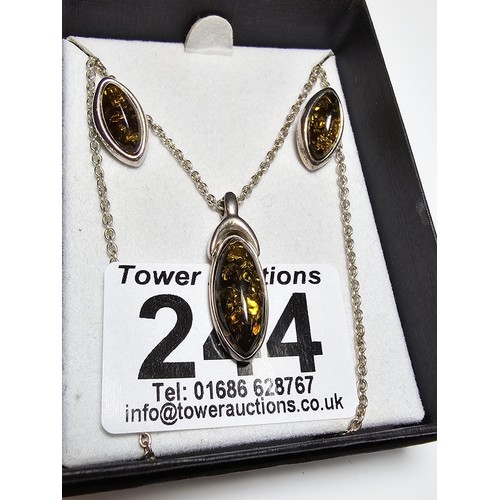 244 - A pretty matching unused 925 silver amber jewellery set which includes a pendant, necklace and stud ... 