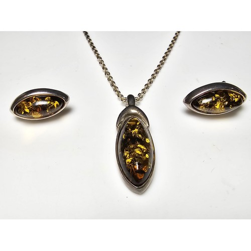 244 - A pretty matching unused 925 silver amber jewellery set which includes a pendant, necklace and stud ... 