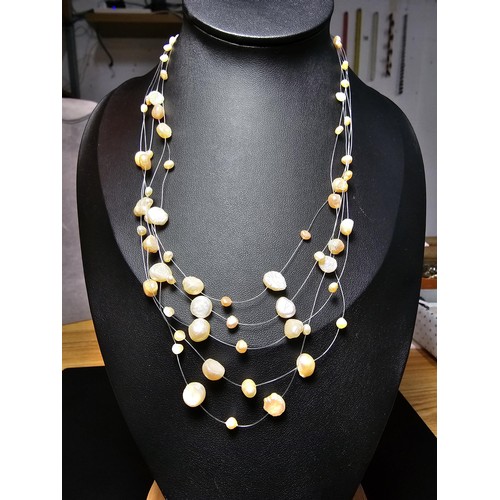 257 - A pretty 18ct gold plated as new multi strand genuine pearl necklace featuring real pearls spread ar... 