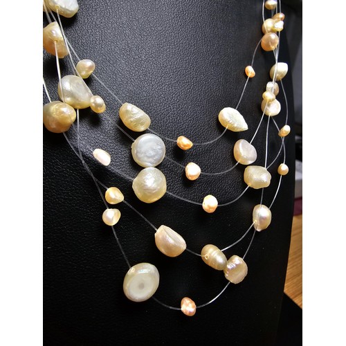 257 - A pretty 18ct gold plated as new multi strand genuine pearl necklace featuring real pearls spread ar... 