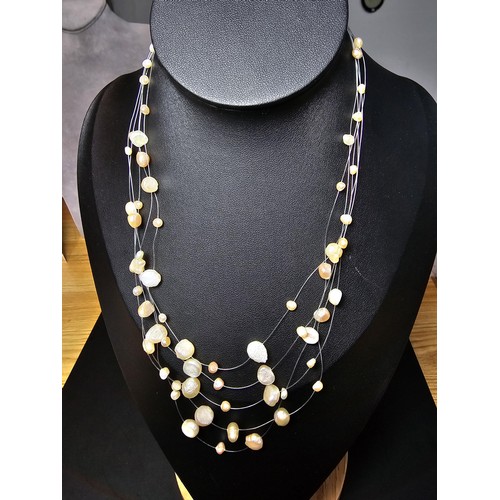 257 - A pretty 18ct gold plated as new multi strand genuine pearl necklace featuring real pearls spread ar... 