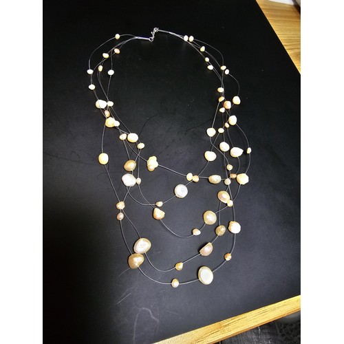 257 - A pretty 18ct gold plated as new multi strand genuine pearl necklace featuring real pearls spread ar... 