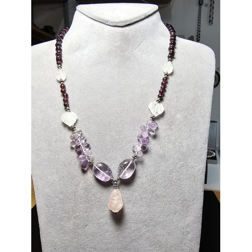 258 - A good quality semi precious stone beaded necklace which features a rose quartz carved drop, amethys... 