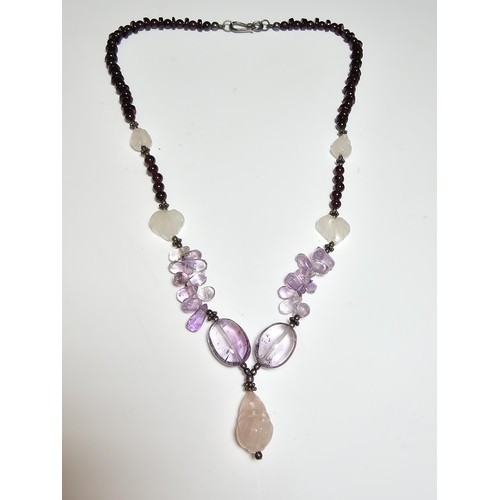 258 - A good quality semi precious stone beaded necklace which features a rose quartz carved drop, amethys... 