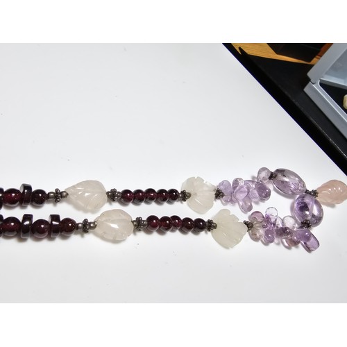 258 - A good quality semi precious stone beaded necklace which features a rose quartz carved drop, amethys... 