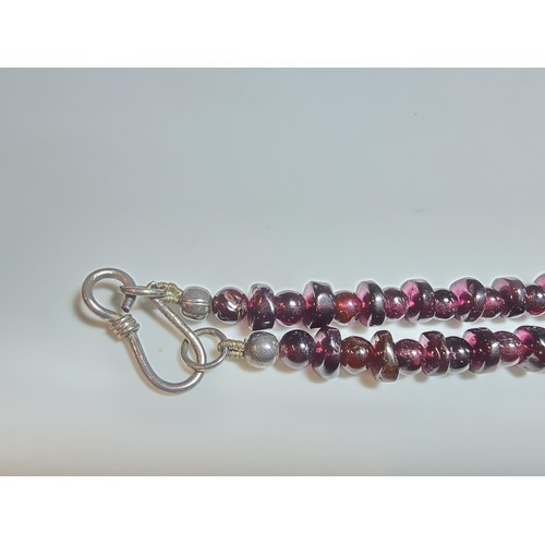 258 - A good quality semi precious stone beaded necklace which features a rose quartz carved drop, amethys... 