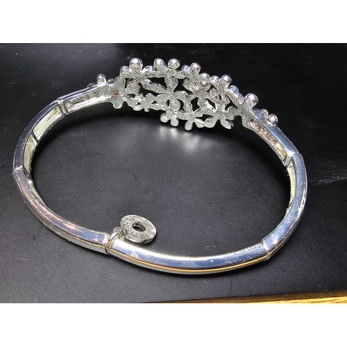 263 - A new and unused pretty silver plated expandable bracelet by equilibrium from the sparkle range havi... 