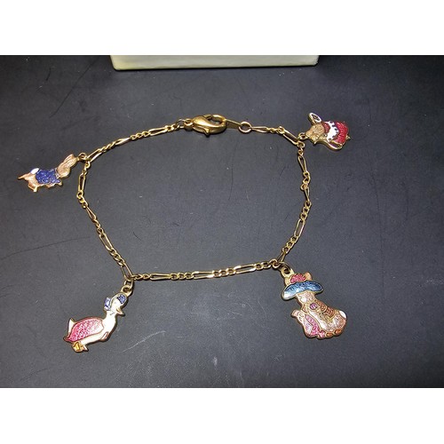 264 - A pretty genuine Beatrix Potter bracelet which is gold plated in 22ct gold featuring 5 enamelled cha... 