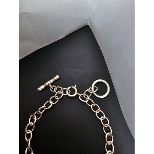 235 - 925 silver bracelet with a hoop and ball clasp and an additional clasp to fit smaller wrists ideal a... 