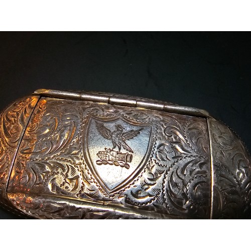 265 - A good quality antique hallmarked silver Vesta case of oblong shape having an ornate engraved design... 