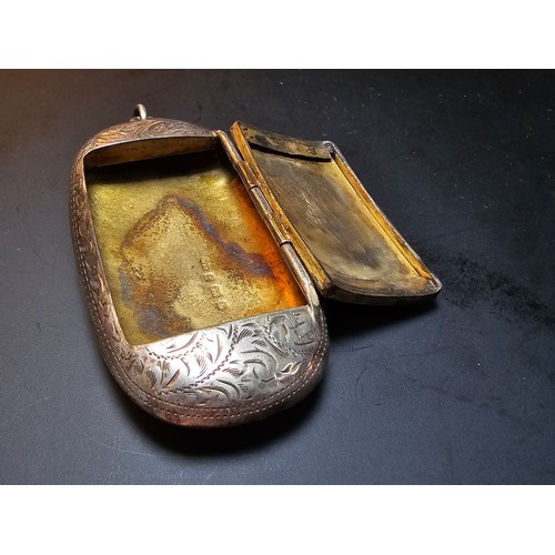 265 - A good quality antique hallmarked silver Vesta case of oblong shape having an ornate engraved design... 