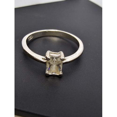 237 - A 925 silver solitaire ring inset with a baguette cut crystal CZ stone, in clean condition and boxed... 