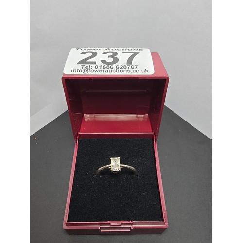 237 - A 925 silver solitaire ring inset with a baguette cut crystal CZ stone, in clean condition and boxed... 