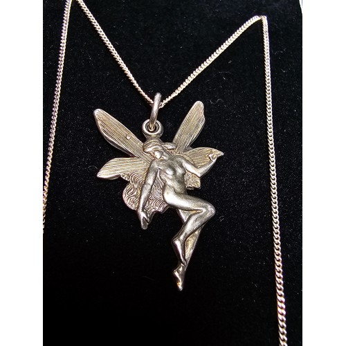 239 - A pretty 925 silver fairy pendant on an 18