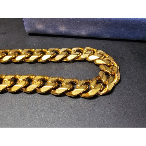 242 - A brand new and unused chunky 18ct gold plated curb link neck chain by Chains House Jewellery. Compl... 