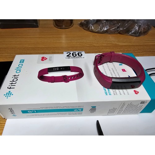 266 - A quantity of 4 various wrist watches which includes a Fitbit Alta HR smart watch, a clean Sector 15... 